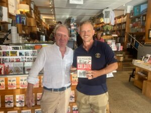 Ben MacIntyre at Bookoccino with a customer